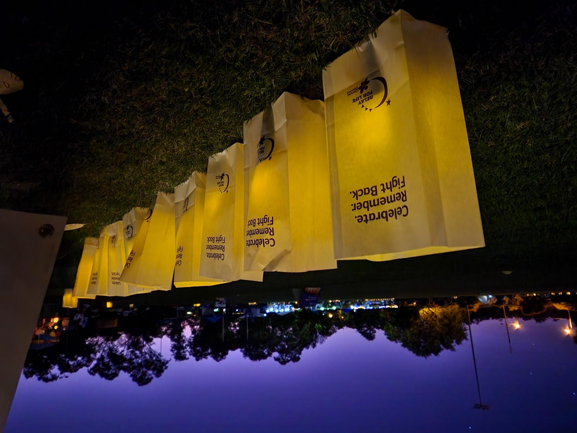 Relay candlelight bags lit at dusk