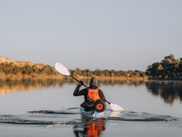 Stewart kayaking along the river Murray
