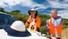 2 men in orange hi-vis applying sunscreen outdoors