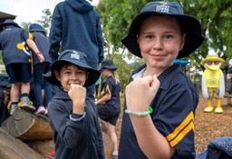 Two Surrey Downs Primary School students showing off their UV bracelets