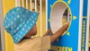Young child using sunsquirt machine